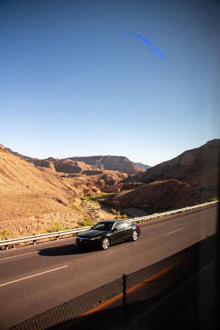 Car on a desert canyon highway in the Southwest