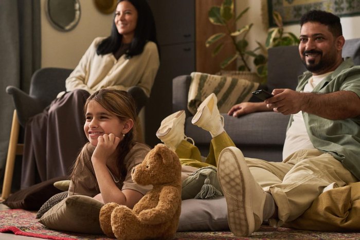 A family relaxing together in their living room