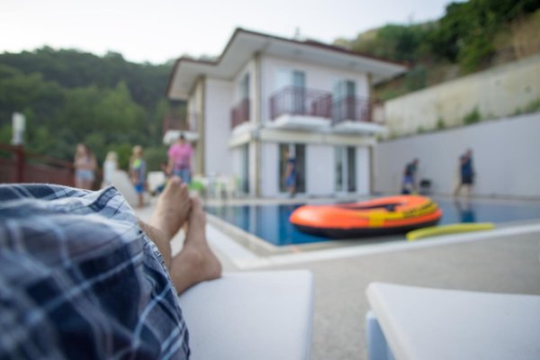 Poolside at a family home on a summer afternoon