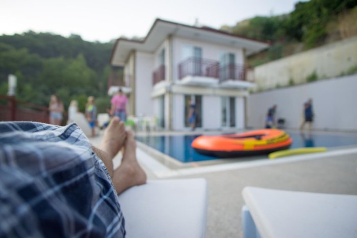 Poolside at a family home on a summer afternoon