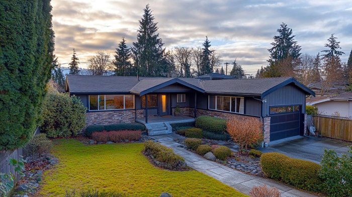 A single-storey ranch home lit at dusk